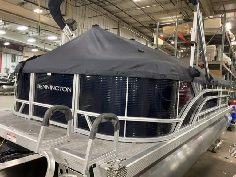 Pontoon boat at Hall's Sport Center, featuring Bennington 22 SSR model. Perfect for leisure and wate.