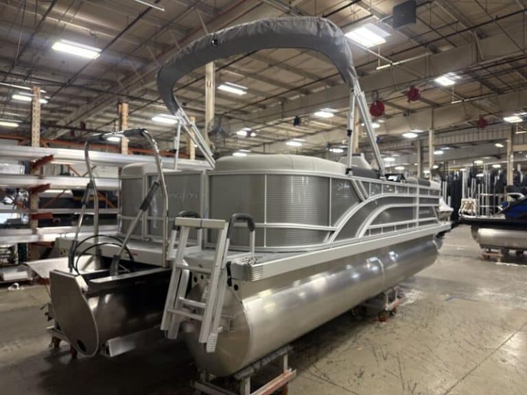 Bennington 22 SSR pontoon boat displayed at Hall's Sport Center, perfect for family fun and water ad.