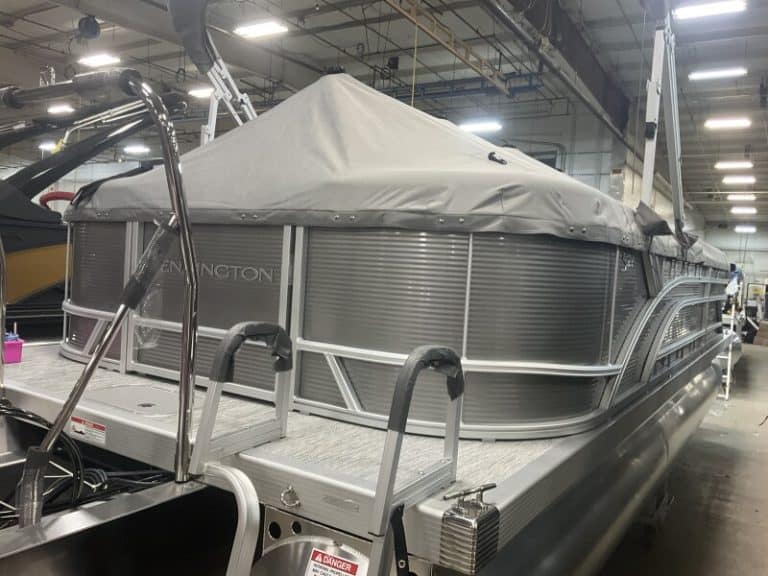 Bennington 22 SSR pontoon boat in showroom at Hall's Sport Center.