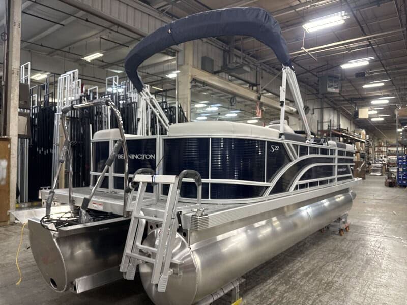Pontoon boat at Hall's Sport Center, ideal for leisure and water adventures.