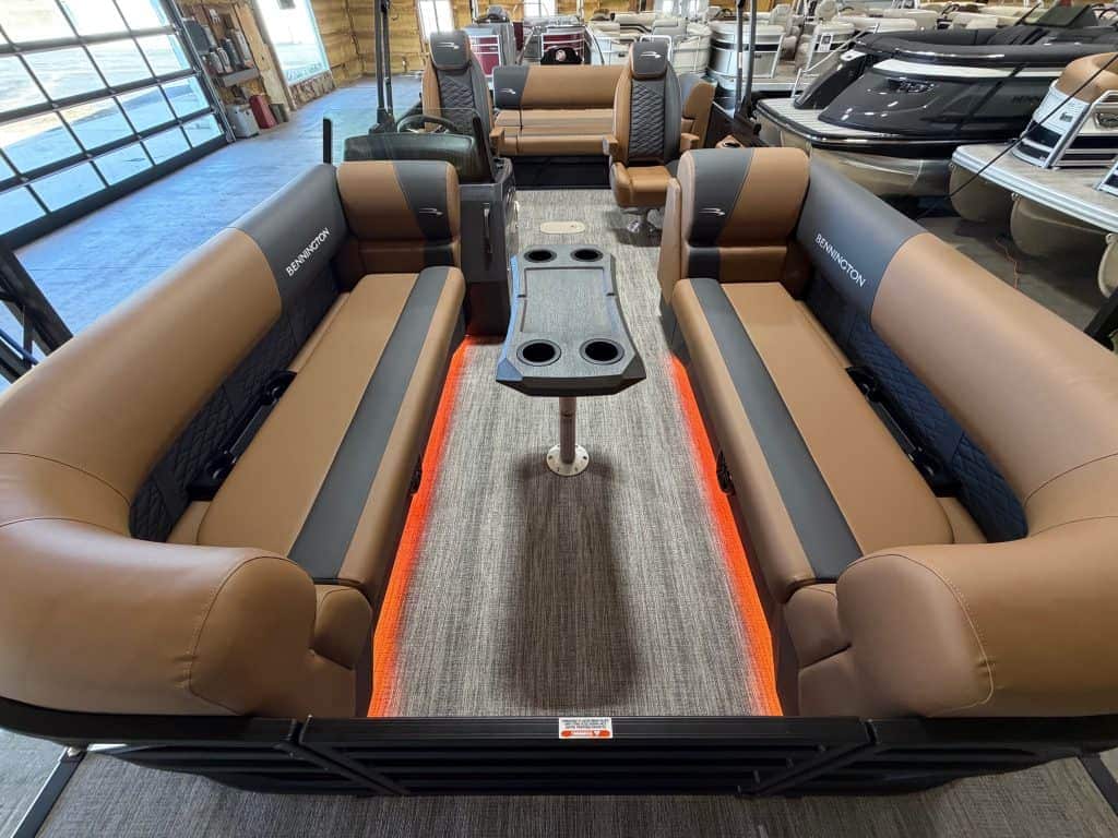 Bennington 23 SSB pontoon boat displayed at Hall's Sport Center, perfect for family outings and wate.