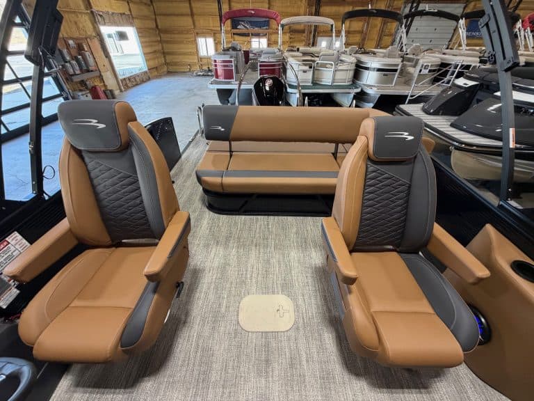 Bennington 23 SSB boat seats with comfortable tan and black upholstery. Perfect for leisure and wate.