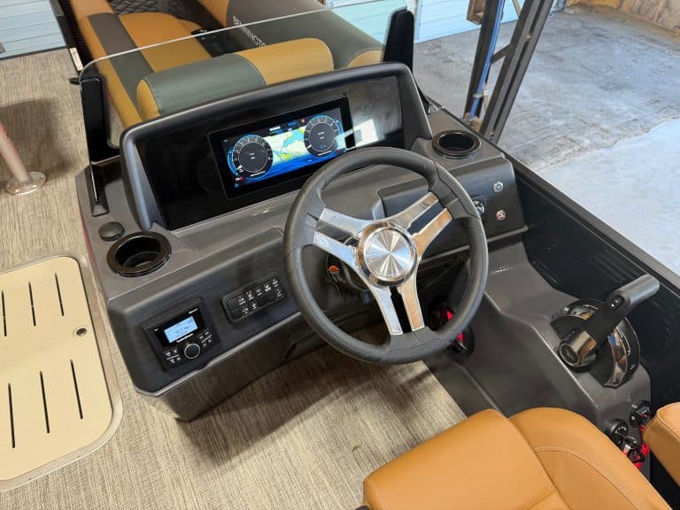 Bennington 23 SSB boat dashboard and steering wheel.