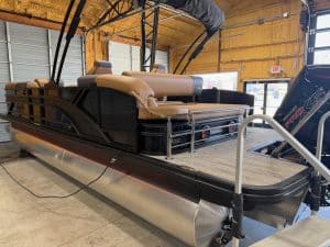 Bennington 23 SSB pontoon boat displayed at Hall's Sport Center, perfect for family boating and wate.