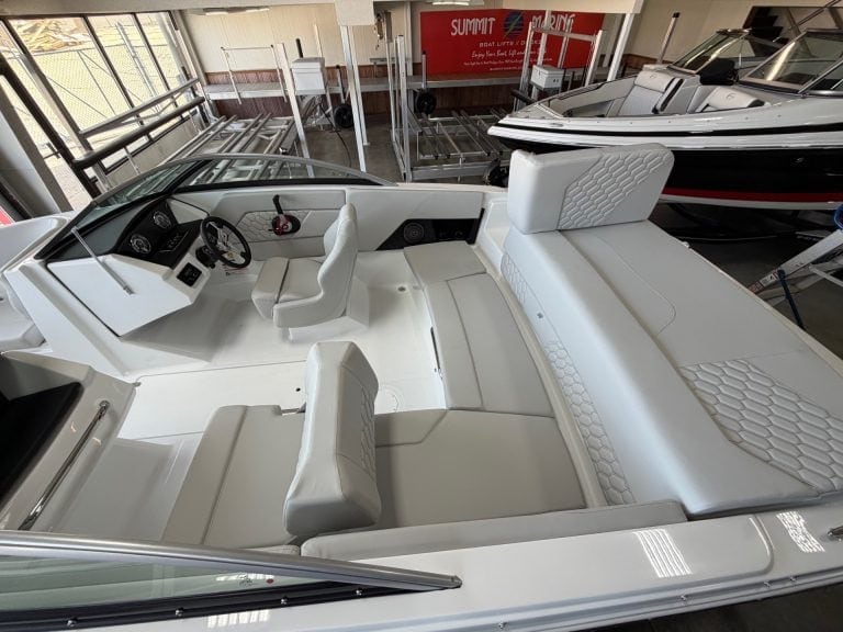 Luxury boat interior with modern dashboard and seating.