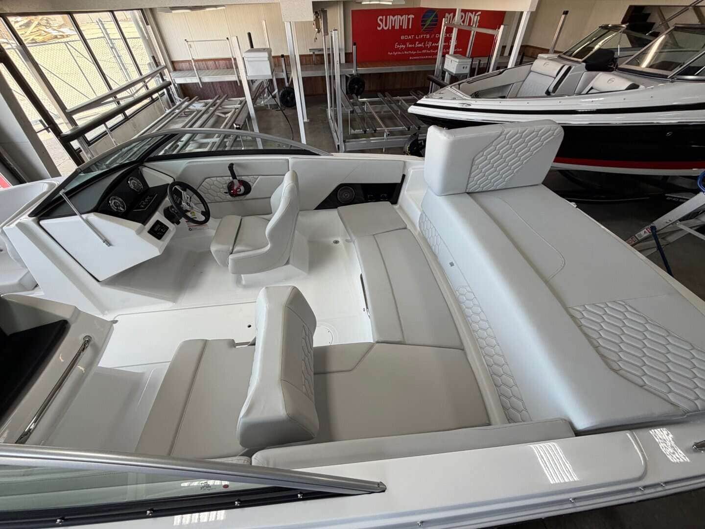 Luxury boat interior with modern dashboard and seating.