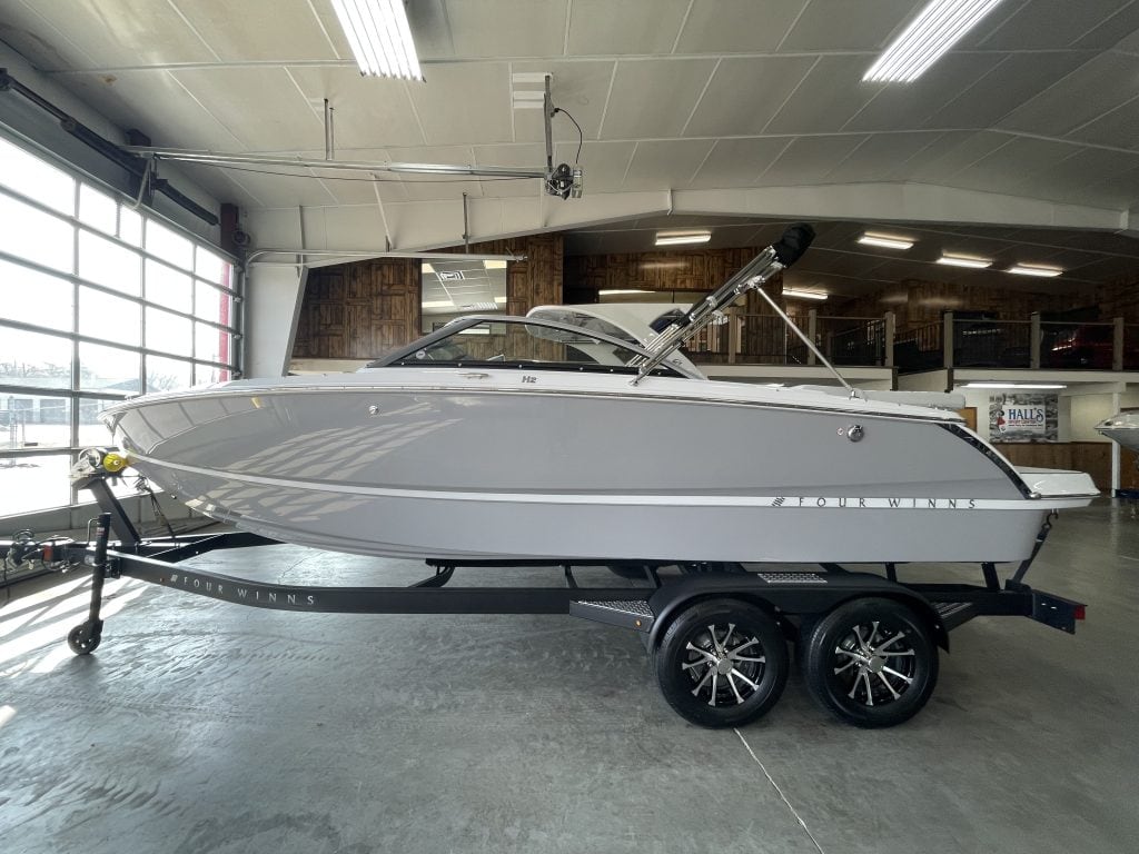 New Four Winns H2 FREEDOM boat on trailer at Hall's Sport Center.