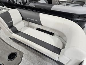 Bennington boat with white and black seating at Hall's Sport Center.