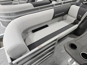 Bennington boat seating with white and black cushions at Hall's Sport Center.