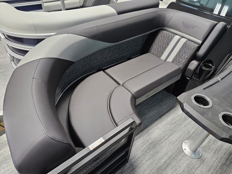 Modern boat interior with curved seating and premium materials.