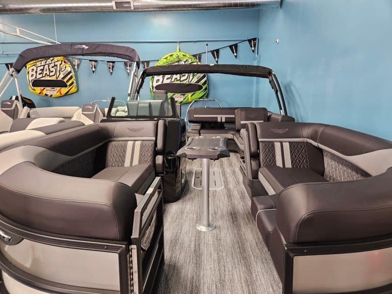 Bennington 22 MSB pontoon boat with seating and steering console.