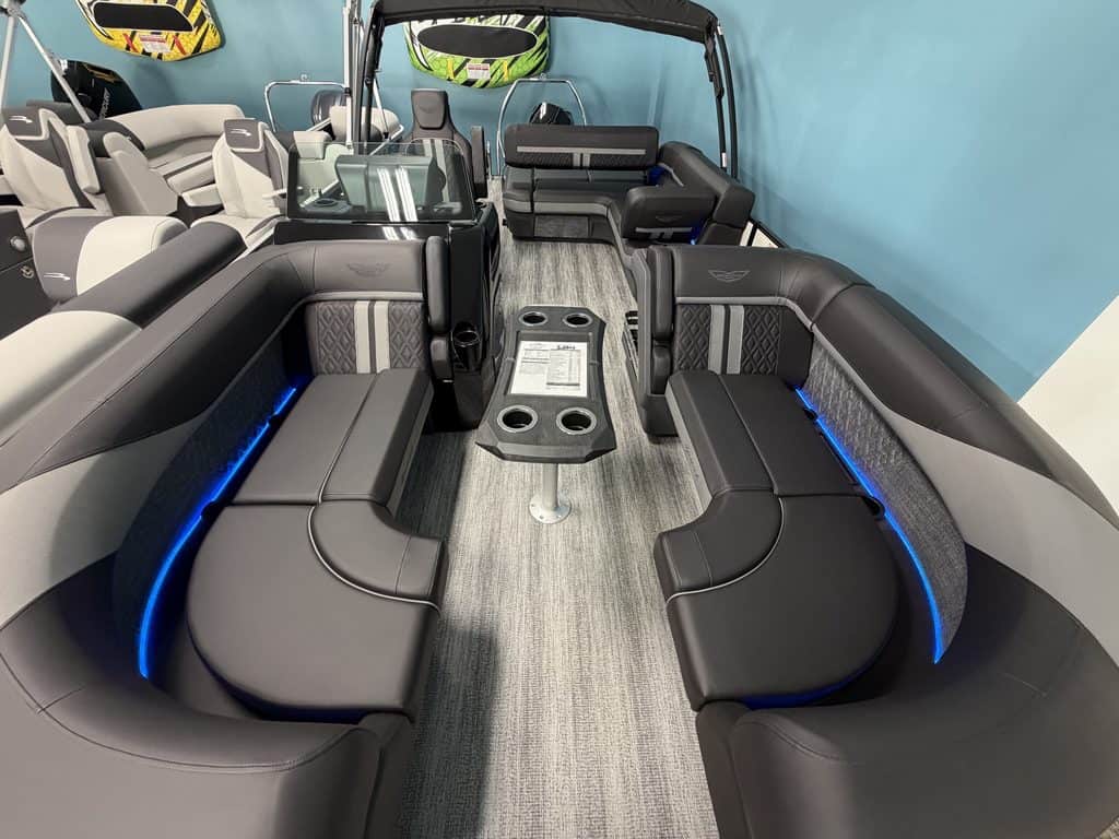 Luxury pontoon boat interior with spacious seating and modern design.