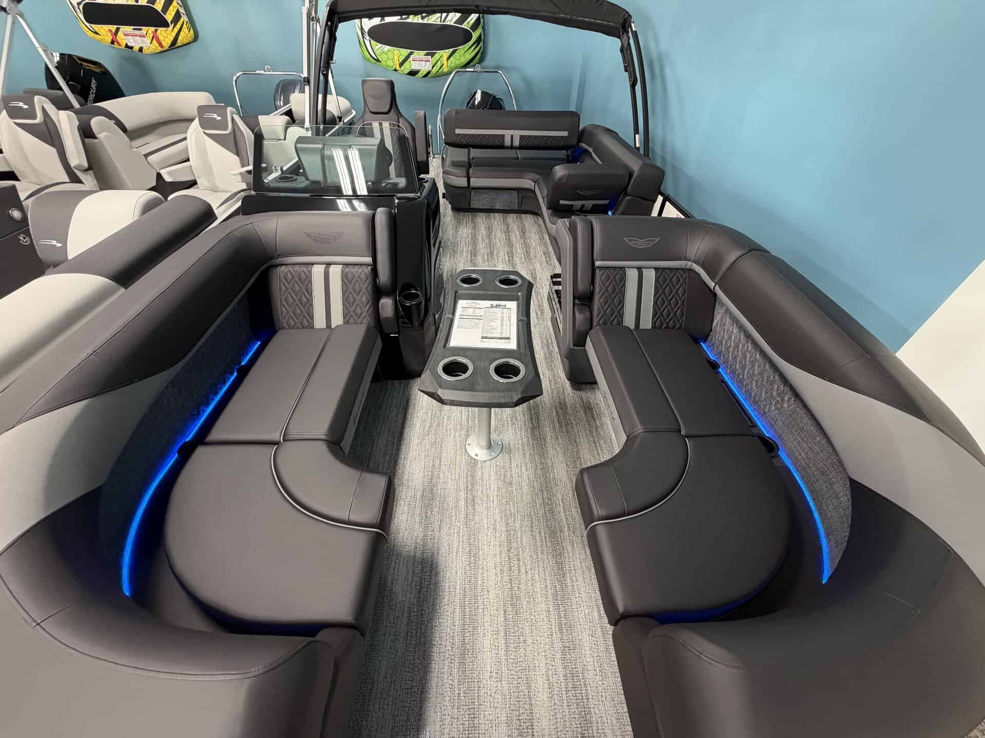 Luxury pontoon boat interior with spacious seating and modern design.