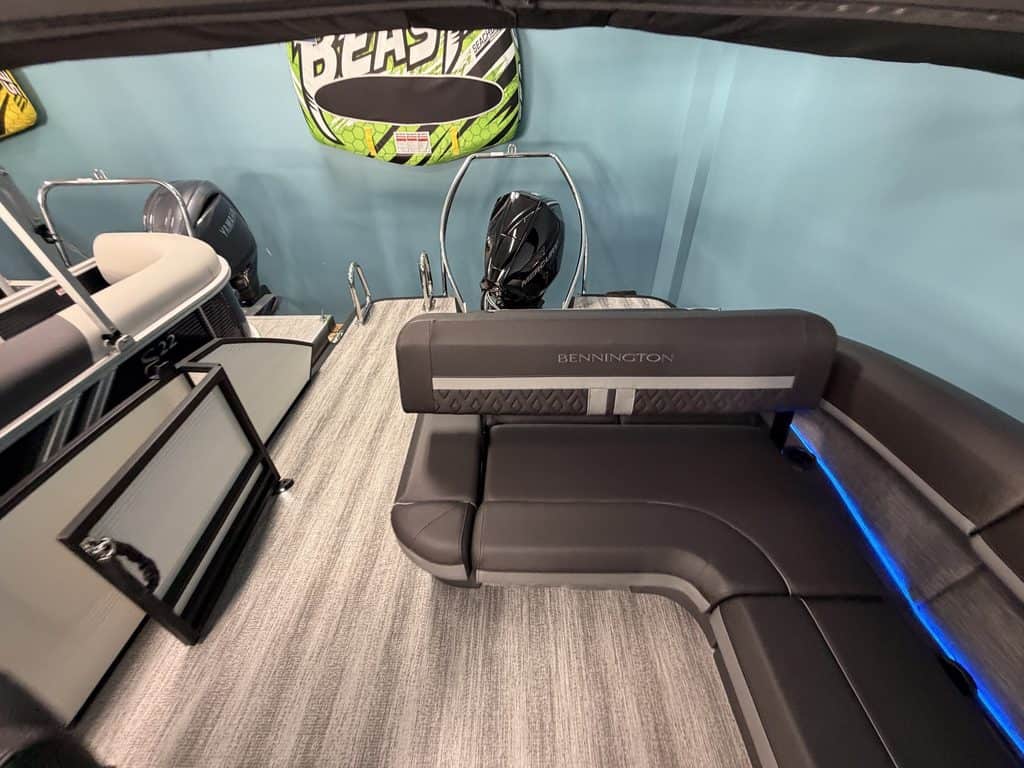 Interior view of a Bennington 22 MSB pontoon boat with seating and equipment.