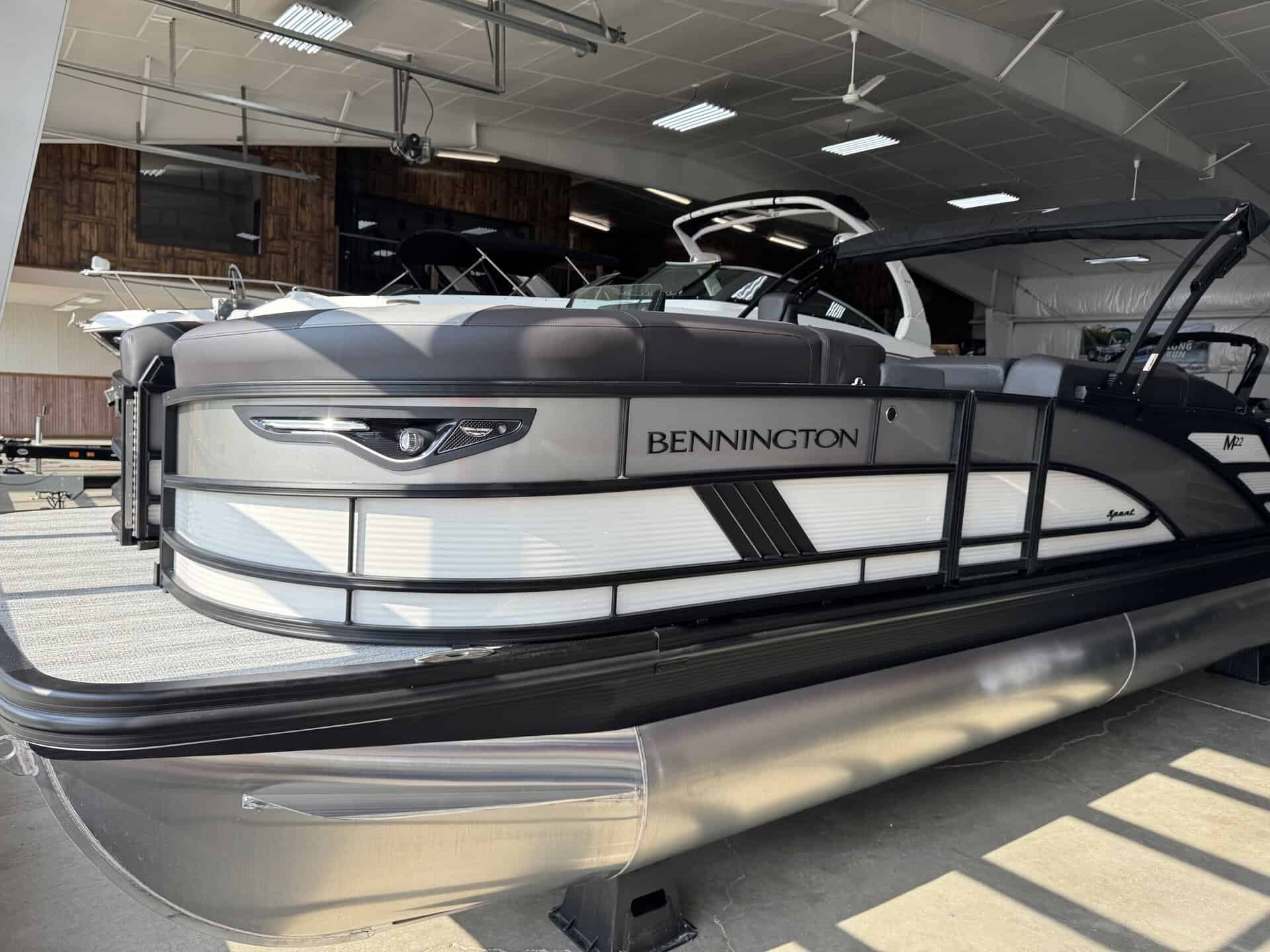 Bennington 22 MSB pontoon boat displayed indoors at Hall's Sport Center.