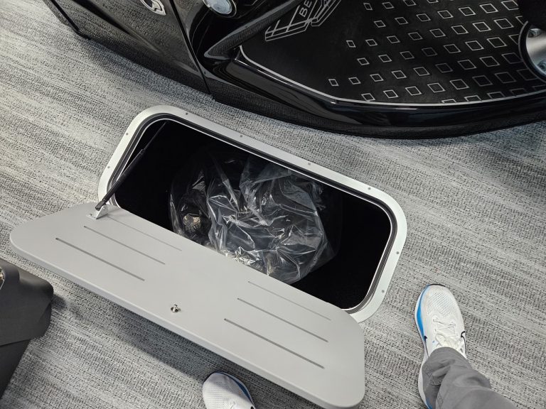 Electric vehicle charging station with a car and a person in sneakers nearby.