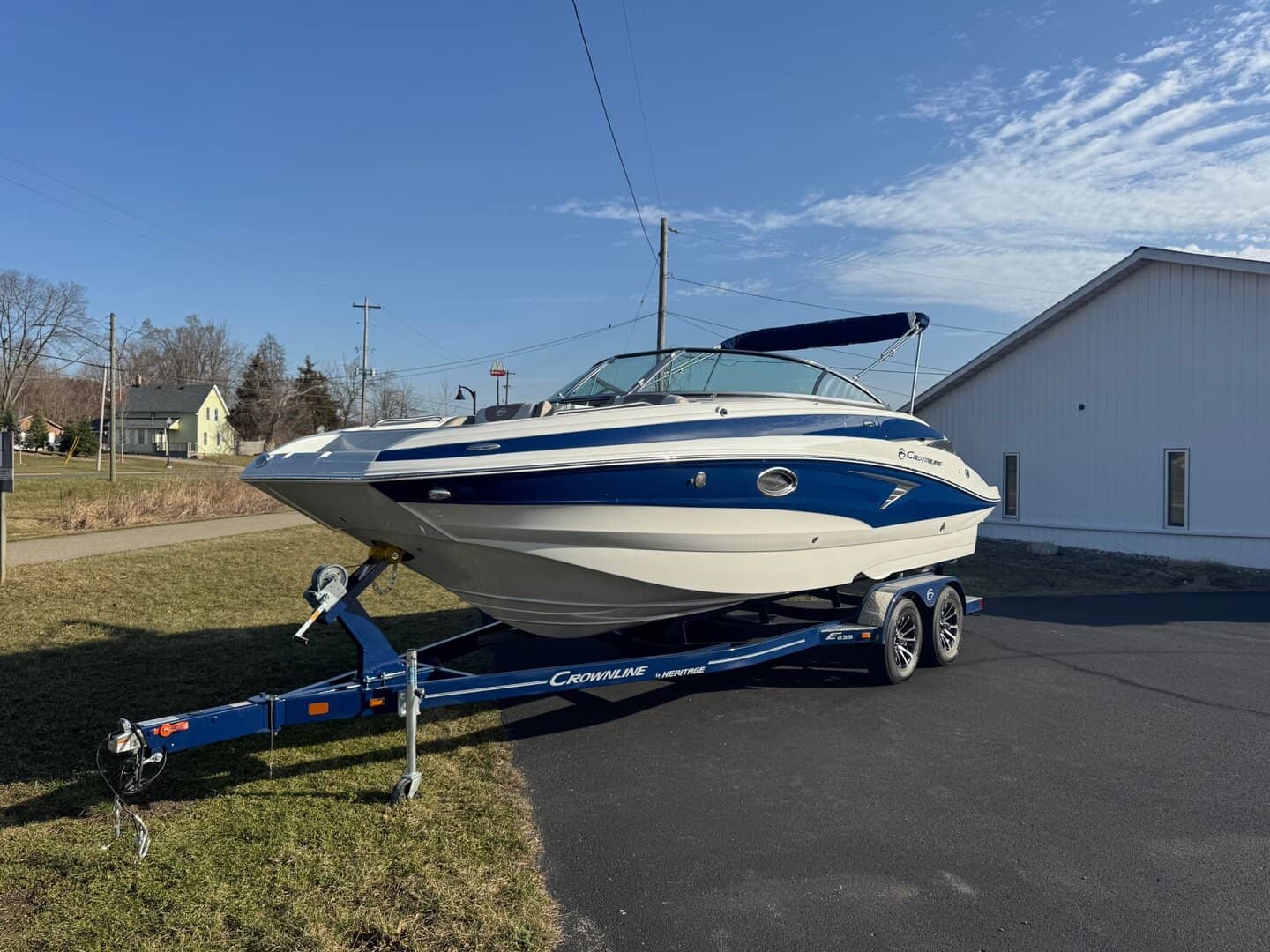 Crownline E235 luxury boat on trailer at Hall's Sport Center.