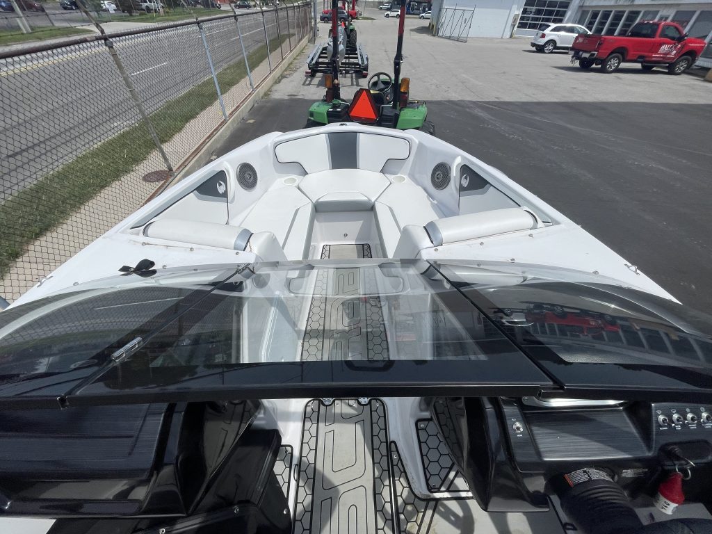2018 Scarab 195 G speedboat displayed outdoors at Hall's Sport Center.