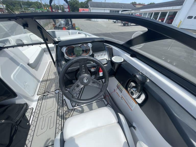 Interior view of a 2018 Scarab 195 G boat showing steering and dashboard.