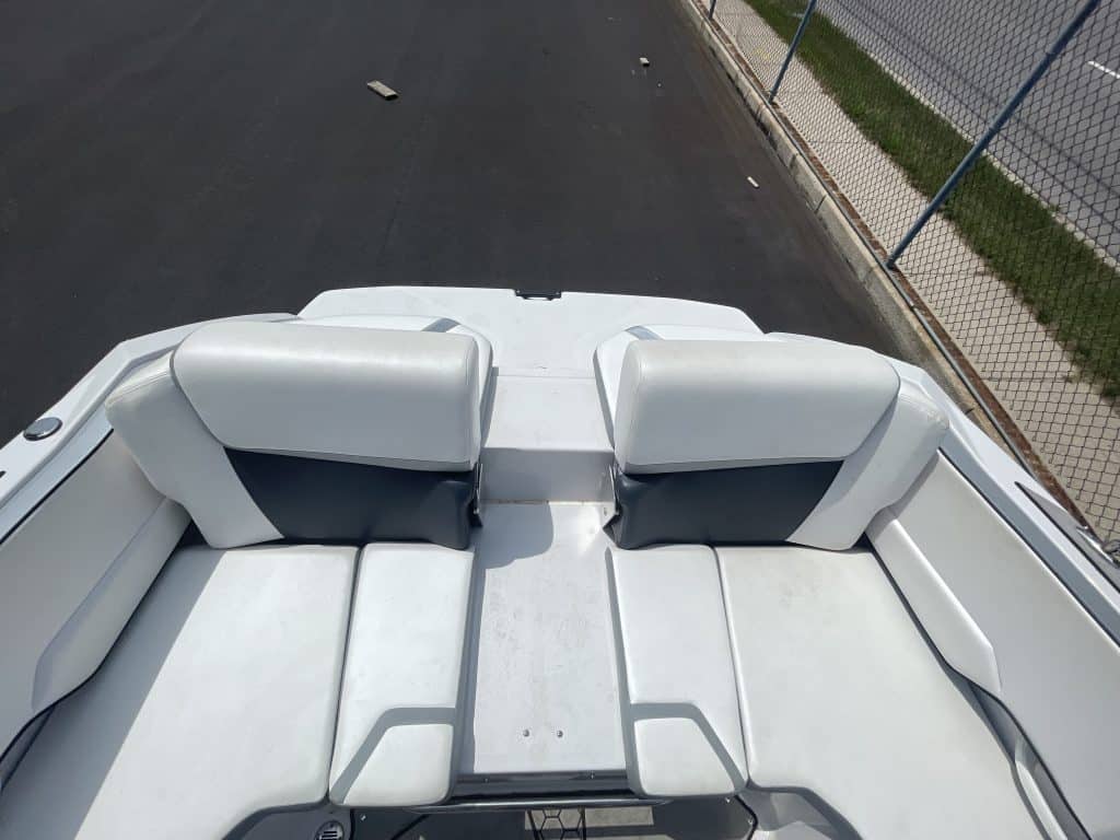 2018 Scarab 195 G speedboat with white seating and sleek design.