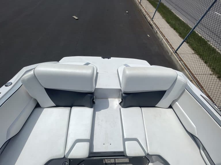 2018 Scarab 195 G speedboat with white seating and sleek design.