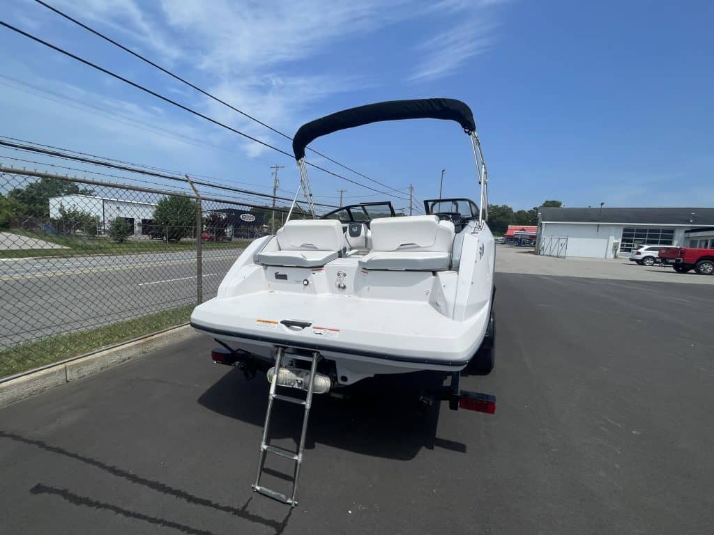 White 2018 Scarab 195 G boat on trailer at Hall's Sport Center.