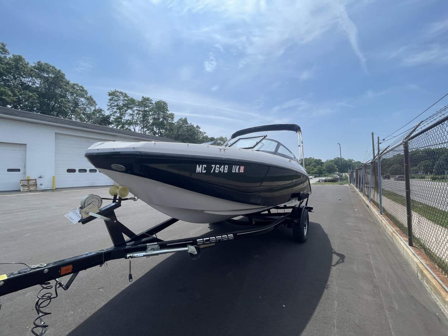 2018 Scarab 195 G speedboat on trailer at Hall's Sport Center.