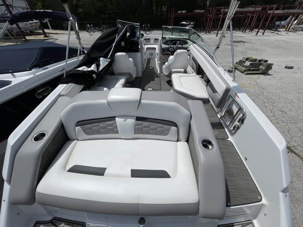 Modern boat interior with white and gray seating at Hall's Sport Center.