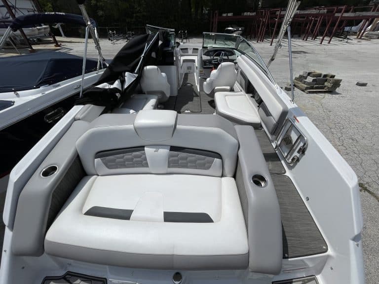 Modern boat interior with white and gray seating at Hall's Sport Center.