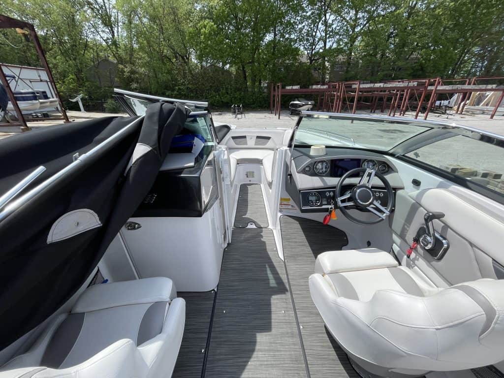 Luxury boat cockpit with modern controls and seating at Hall's Sport Center.