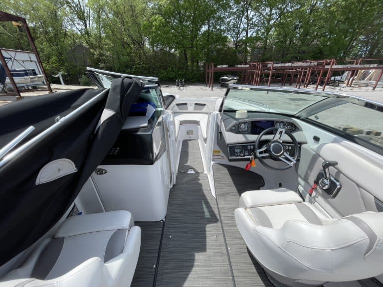 Luxury boat cockpit with modern controls and seating at Hall's Sport Center.