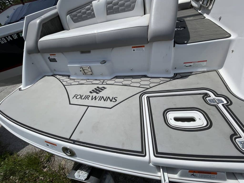 Aluminum boat deck with seating and non-slip surface at Hall's Sport Center.
