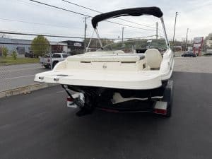 Pontoon boat on trailer at Hall's Sport Center for sale or rent.