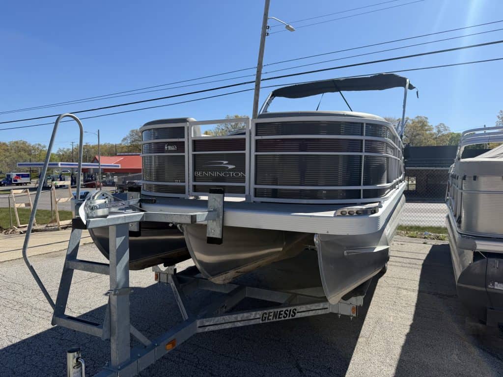 Pontoon boat on display at Hall's Sport Center, perfect for lake fun and water recreation.