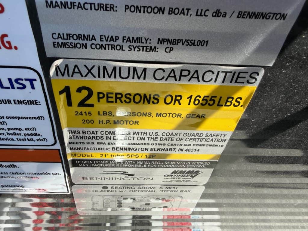 Capacity label for pontoon boat indicating 12 persons or 1655 lbs limit.