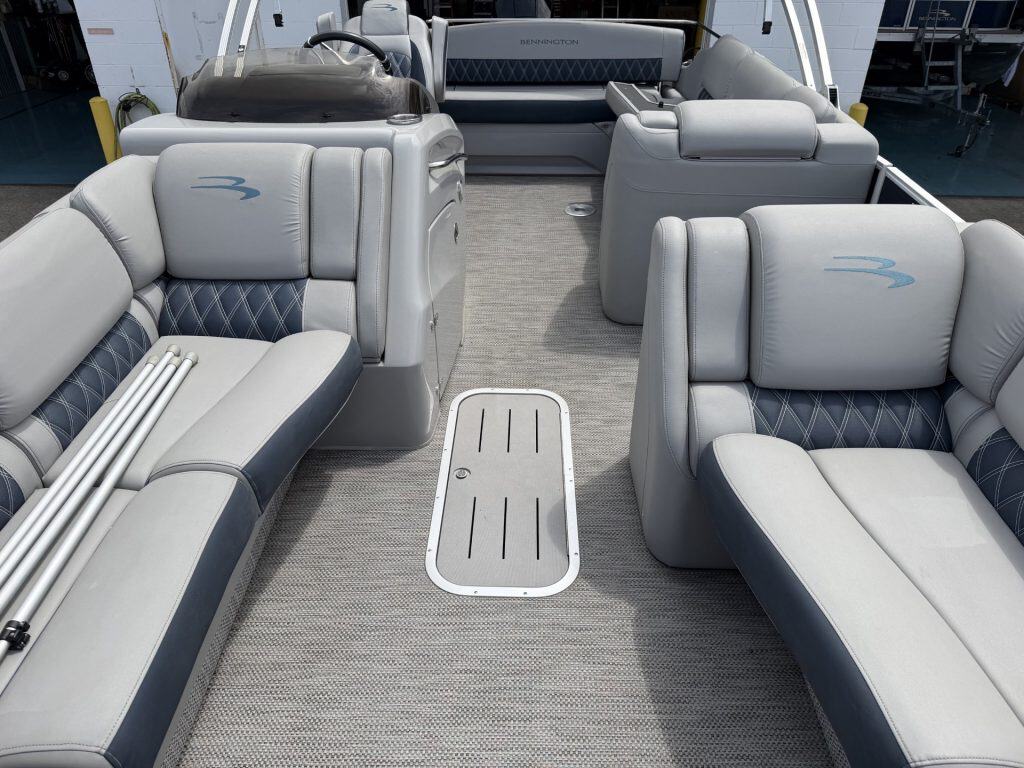 Luxury pontoon boat interior with spacious seating and modern design.