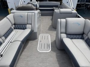 Luxury pontoon boat interior with spacious seating and modern design.