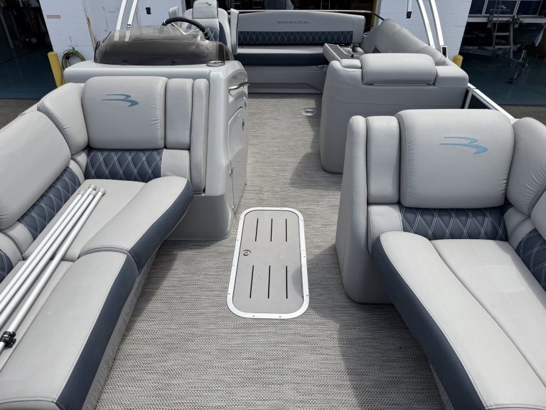 Luxury pontoon boat interior with spacious seating and modern design.