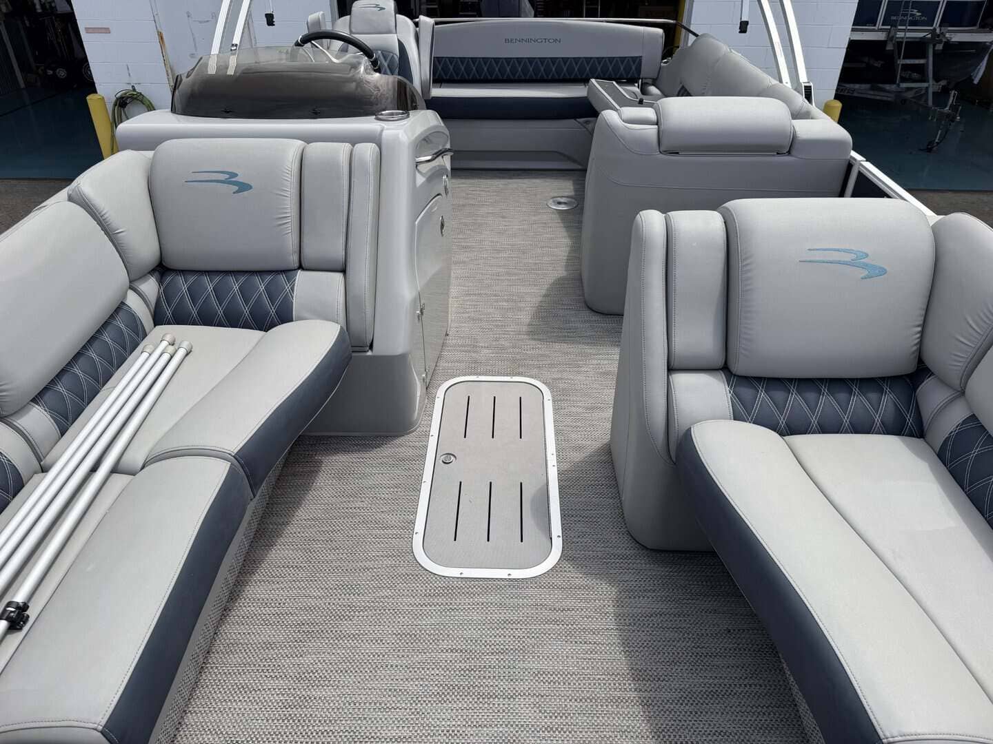 Luxury pontoon boat interior with spacious seating and modern design.