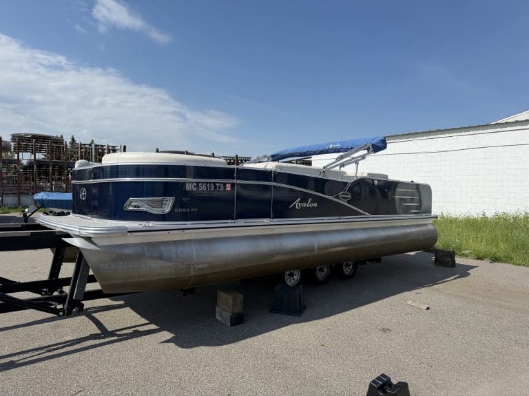 Boat on trailer at Hall's Sport Center, ideal for water sports and outdoor activities.