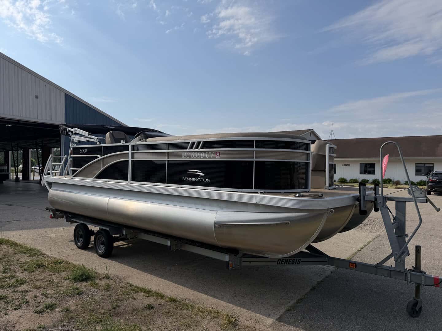 Bennington 21SXL pontoon boat on trailer at Hall's Sport Center.