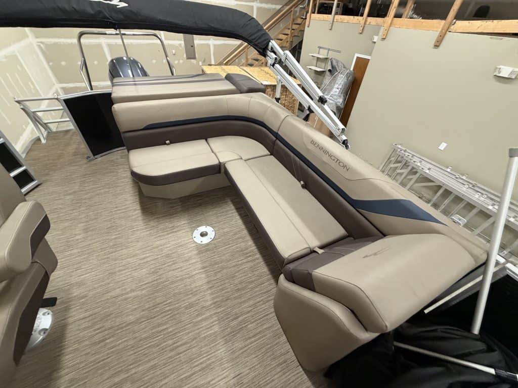 Bennington 21SXL pontoon boat seating with beige and brown upholstery.