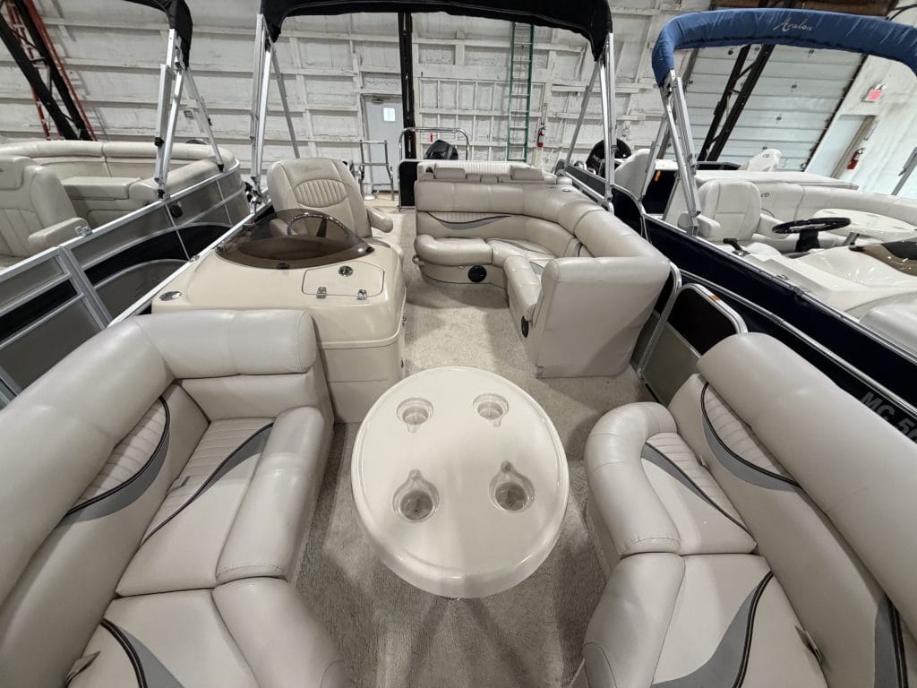 Luxury 2010 Berkshire 223 SLX pontoon boat with seating and canopy.