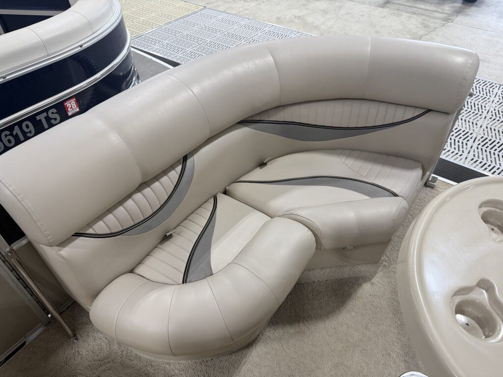 Elegant white boat seating with curved design at Hall's Sport Center.
