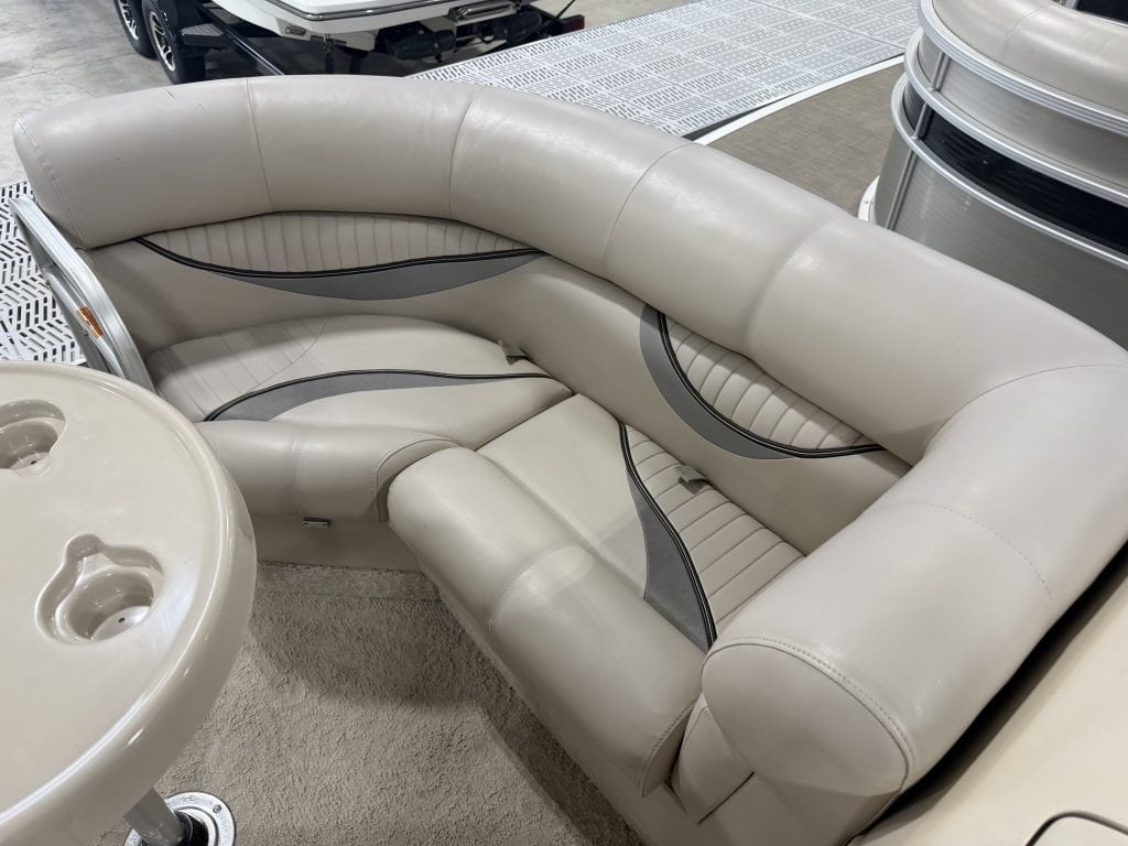 Elegant white boat seating with curved design at Hall's Sport Center.