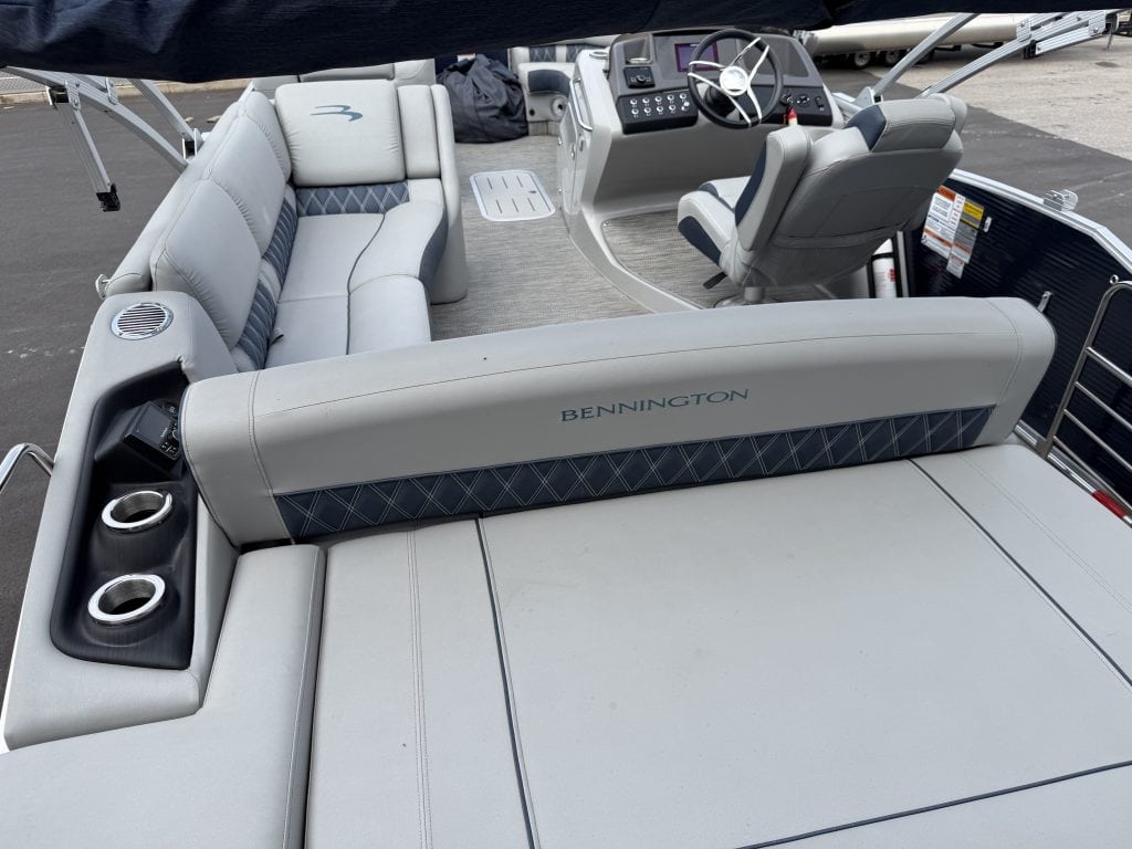 Close-up of Bennington 25QSB pontoon boat seating and dashboard.