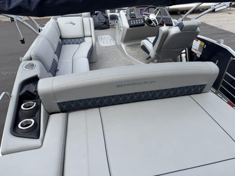 Close-up of Bennington 25QSB pontoon boat seating and dashboard.