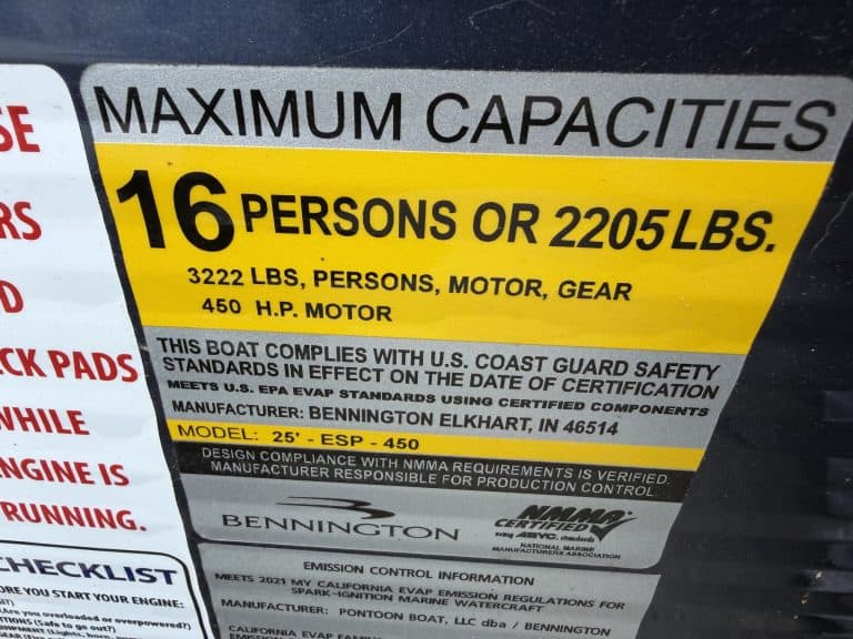 Maximum capacity label for Bennington 25QSB boat with 16 persons or 2205 lbs.