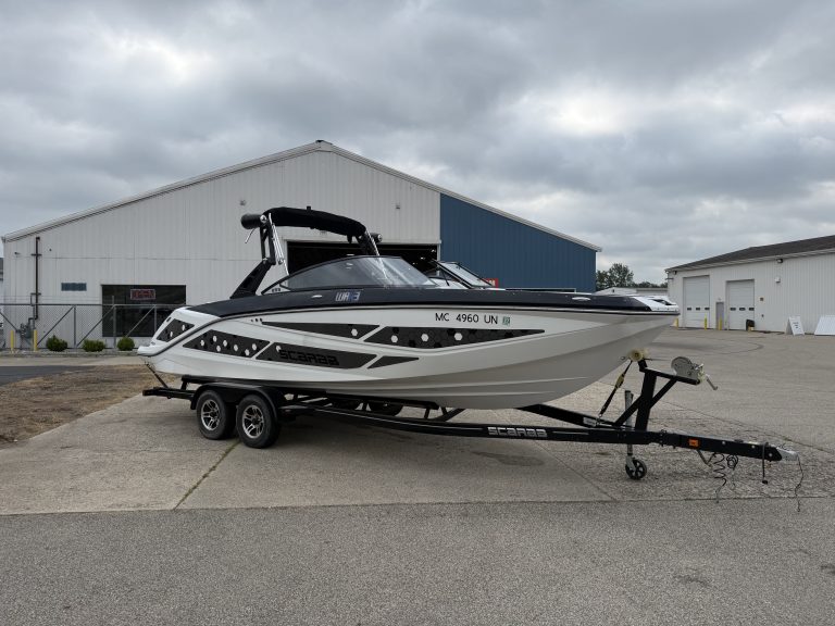 Luxury 2021 Scarab 255ID powerboat on trailer at marina.