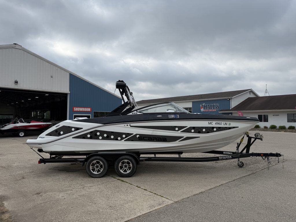 2021 Scarab 255ID speedboat on trailer outside Hall's Sport Center.